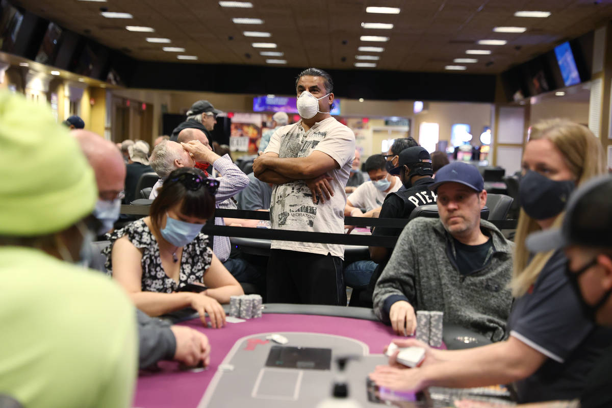 Douglas Roussard of Las Vegas waits in line to enter his name to play poker during the first da ...