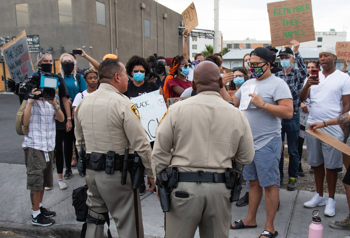 Las Vegas police speak with protesters to determine the route of the protest during a Black Liv ...