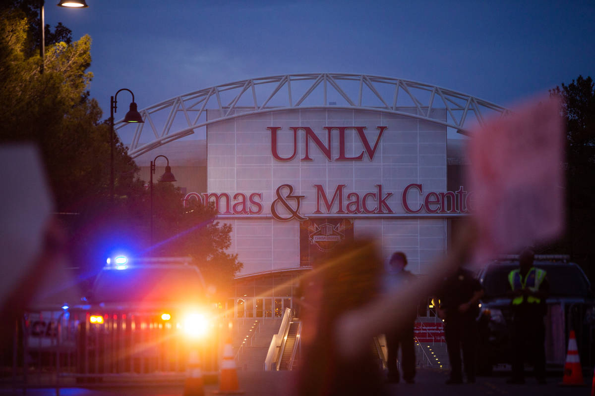 Protesters march by the Thomas and Mack Center as police escort them during a Black Lives Matte ...