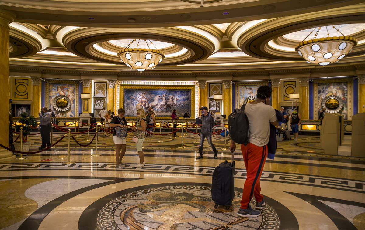 Guests begin to arrive and check in following re-opening ceremonies at Caesars Palace on Thursd ...
