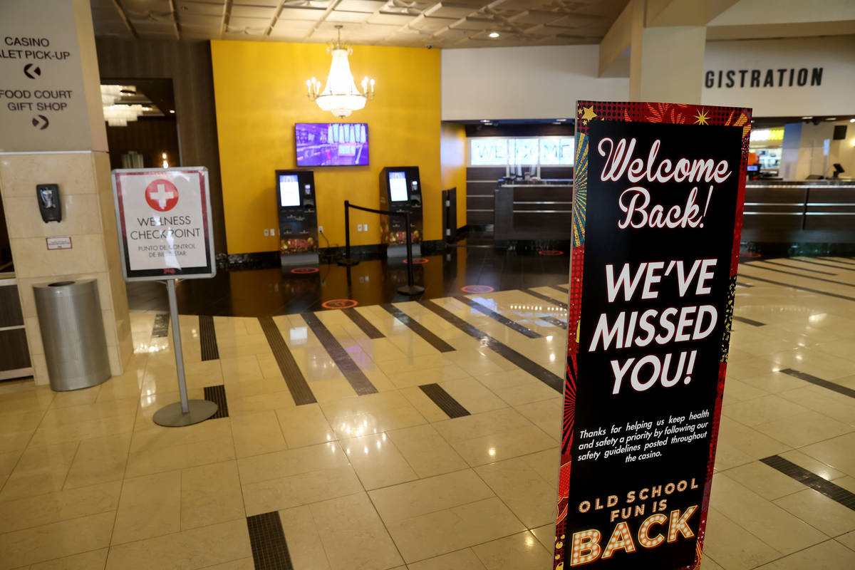 Signs welcome guests back to the Plaza in downtown Las Vegas Wednesday, June 3, 2020. (K.M. Can ...