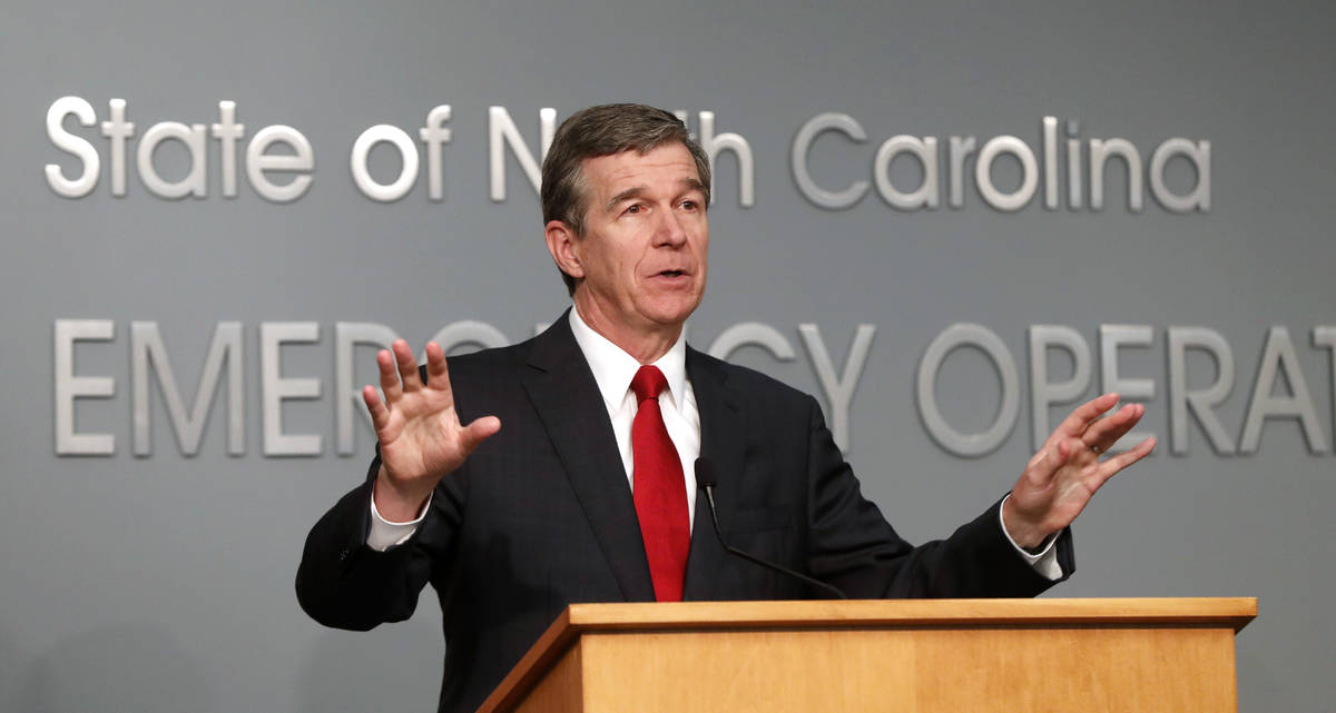 North Carolina Gov. Roy Cooper speaks during a briefing at the Emergency Operations Center in R ...