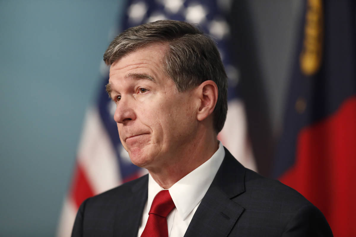 North Carolina Gov. Roy Cooper speaks during a briefing at the Emergency Operations Center in R ...
