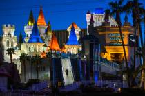 A pedestrian walks down from the bridge across from the Excalibur at Las Vegas Boulevard on the ...