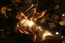 Hong Kong participants attend a candlelight vigil at Democracy Square in Taipei, Taiwan, Thursd ...