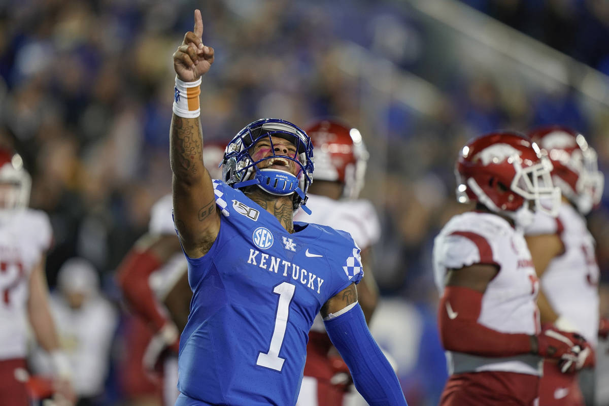 Kentucky quarterback Lynn Bowden Jr. (1) celebrates after throwing a touchdown pass during the ...