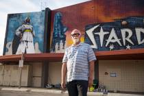 Artist James Stanford stands in front of his mural, “From the Land Beyond Beyond,&#x201d ...