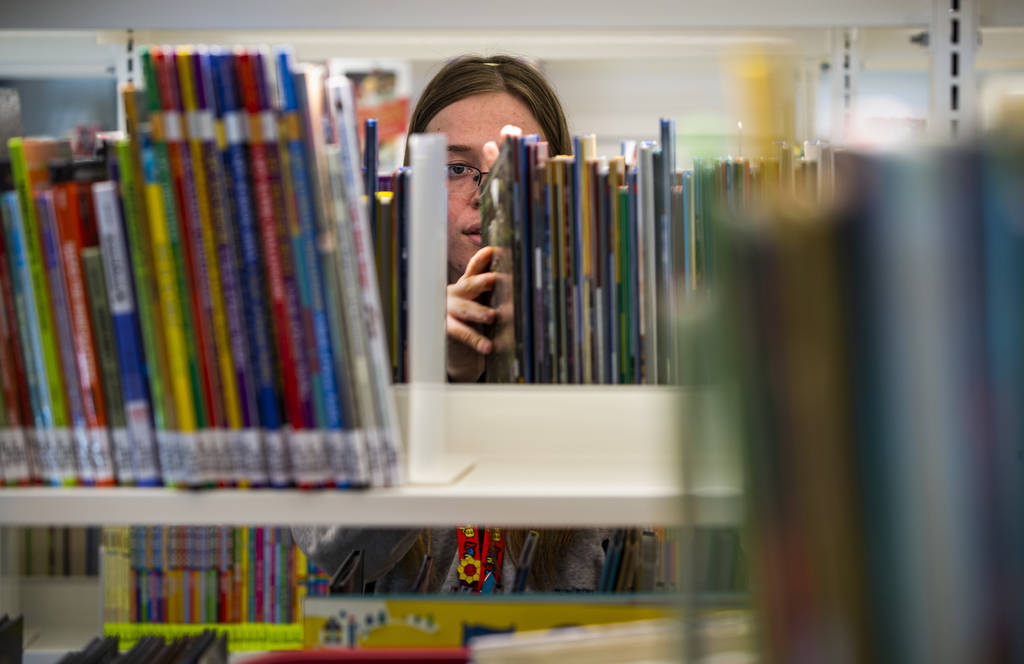 Rachel Hiatt shelves more kids books as work continues on the new East Las Vegas Library, Las V ...