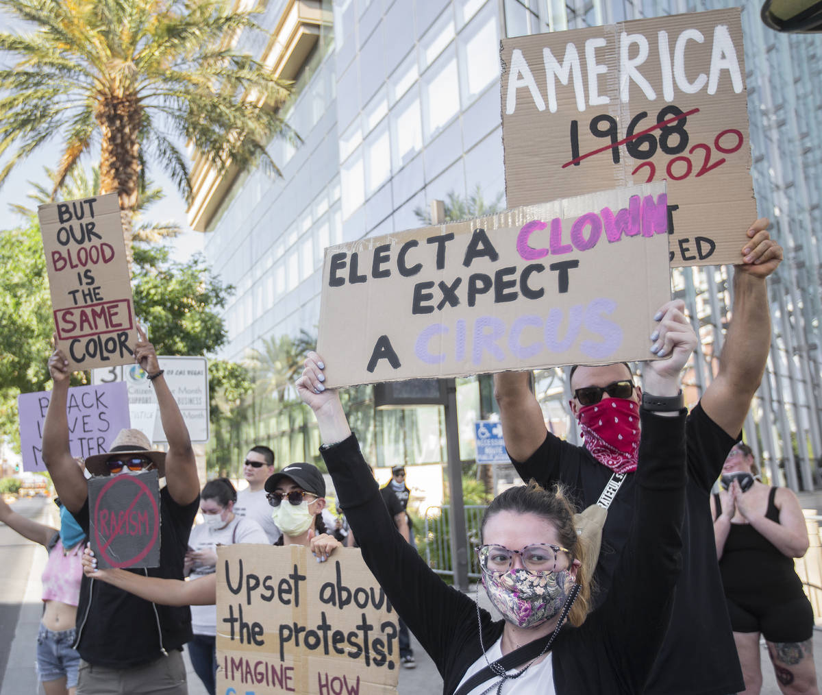 A crowd of at least 300 people protest outside Las Vegas City Hall on Wednesday, June 3, 2020, ...