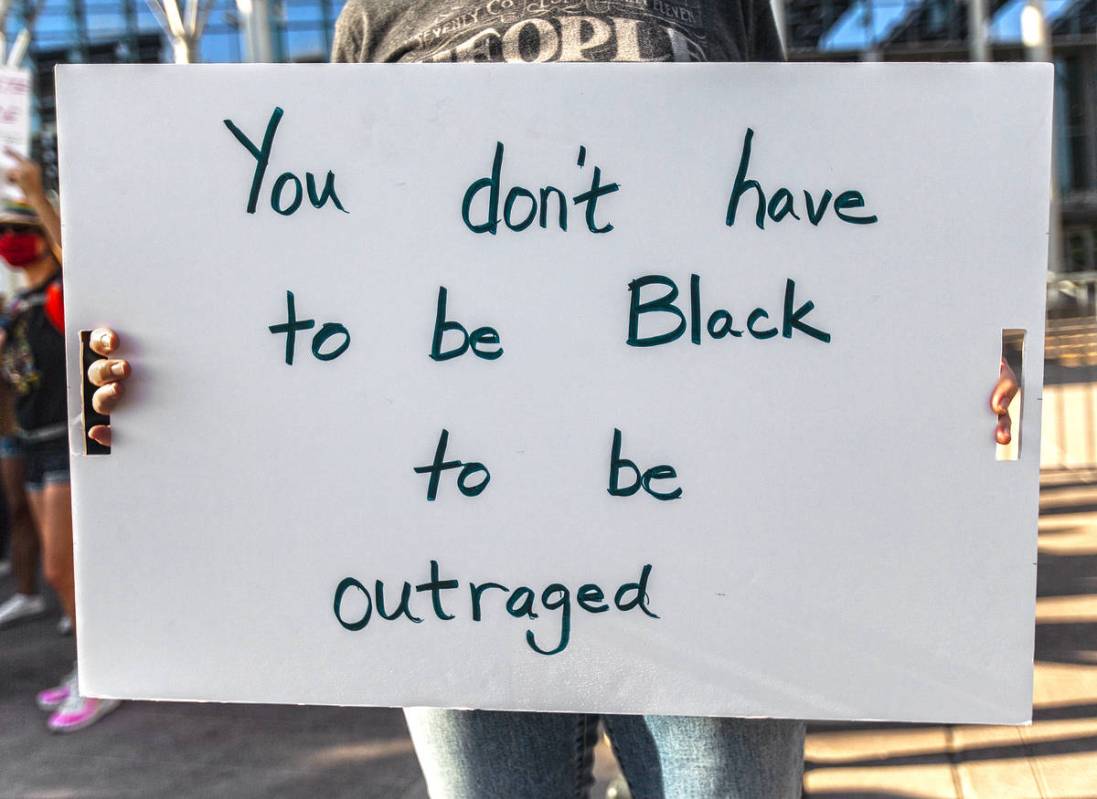A crowd of at least 300 people protest outside Las Vegas City Hall on Wednesday, June 3, 2020, ...