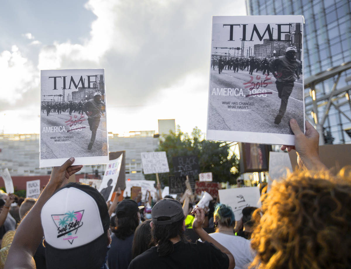 A crowd of at least 300 people protest outside Las Vegas City Hall on Wednesday, June 3, 2020, ...