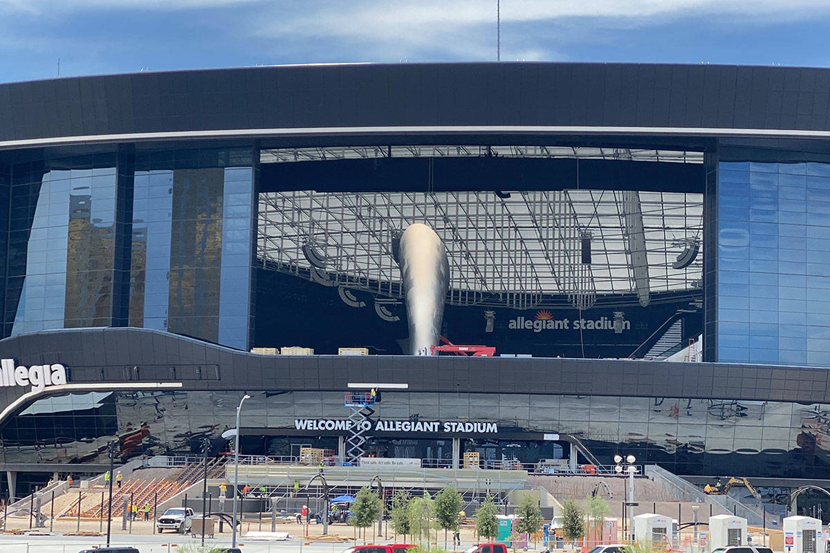 The Al Davis memorial torch seen through the open lanai doors at Allegiant Stadium on Wednesday ...