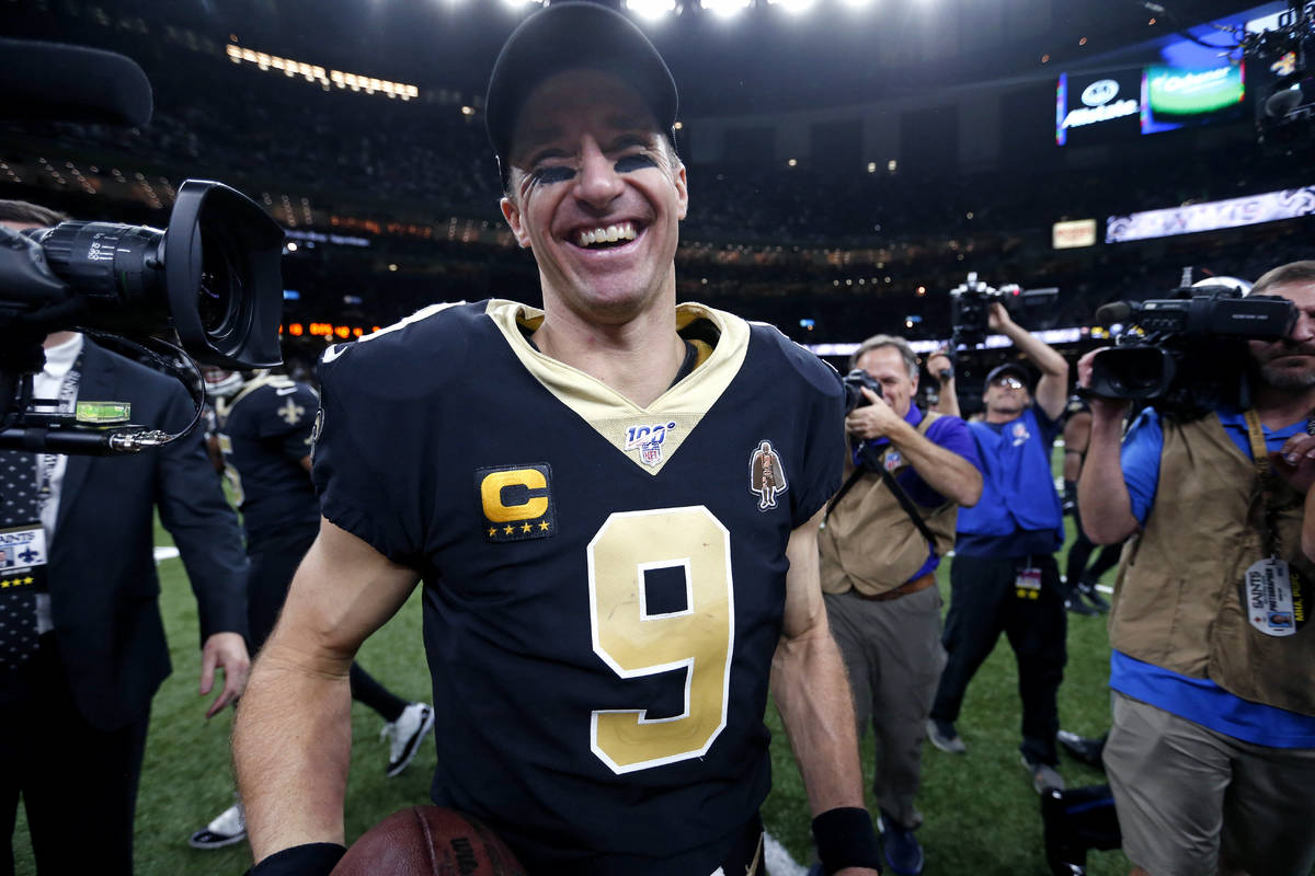 FILE - In this Dec. 16, 2019, file photo, New Orleans Saints quarterback Drew Brees (9) smiles ...