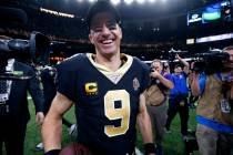 FILE - In this Dec. 16, 2019, file photo, New Orleans Saints quarterback Drew Brees (9) smiles ...