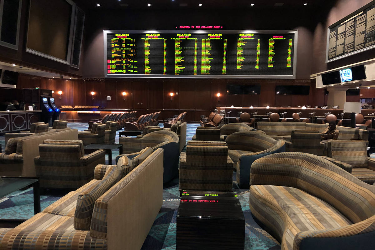 The sportsbook sits vacant within the Bellagio as MGM shuts down casino operations at midnight ...