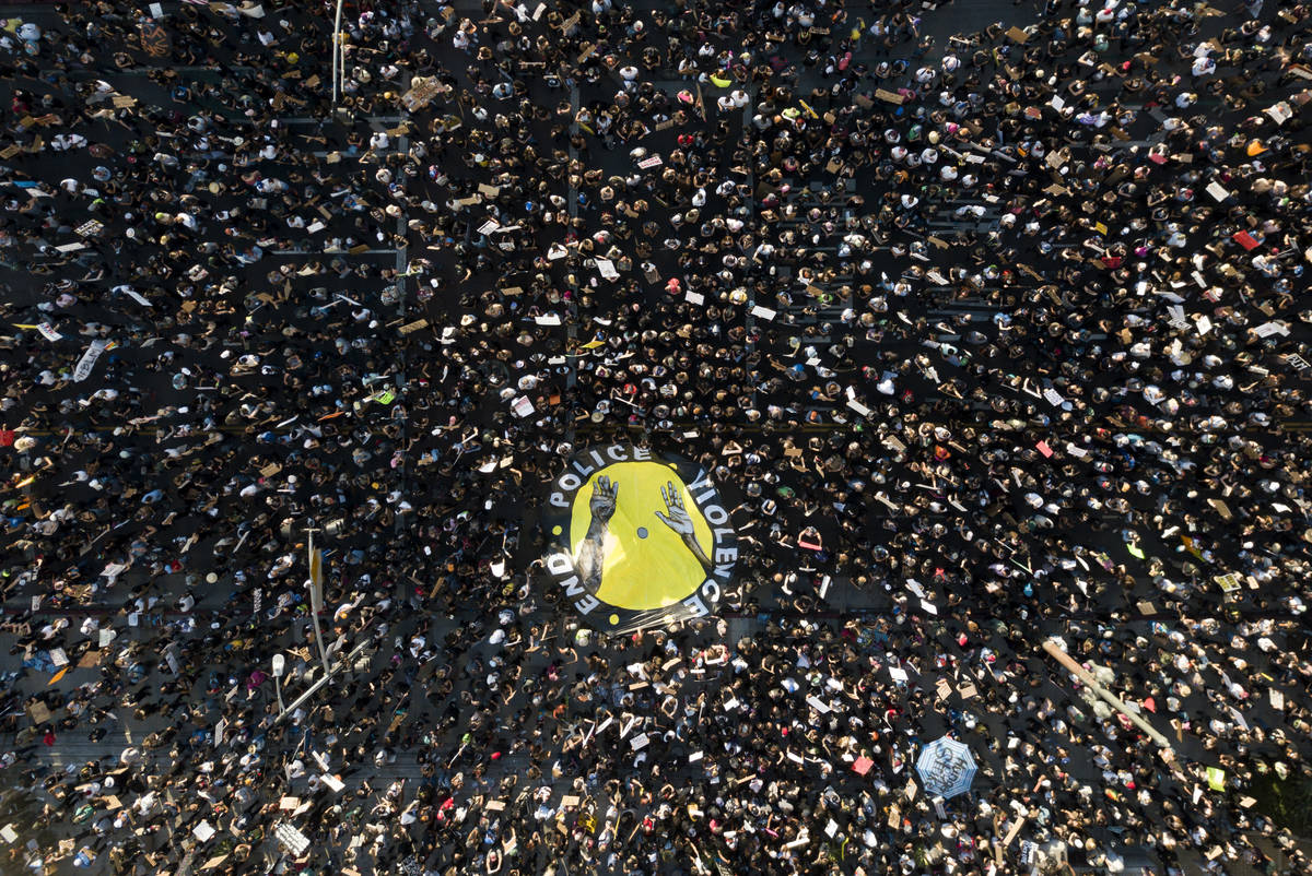 Demonstrators take part in a protest, Wednesday, June 3, 2020, in downtown Los Angeles, sparked ...