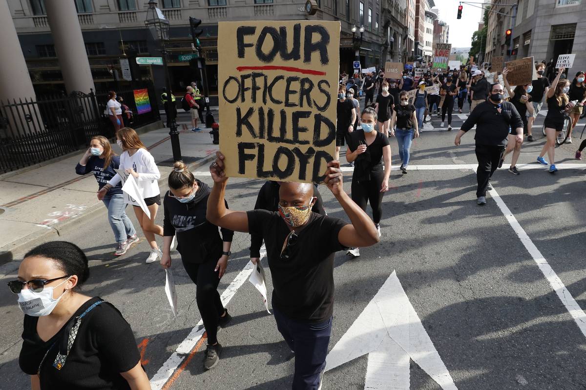 People march in protest against police brutality in Boston, Wednesday, June 3, 2020, following ...