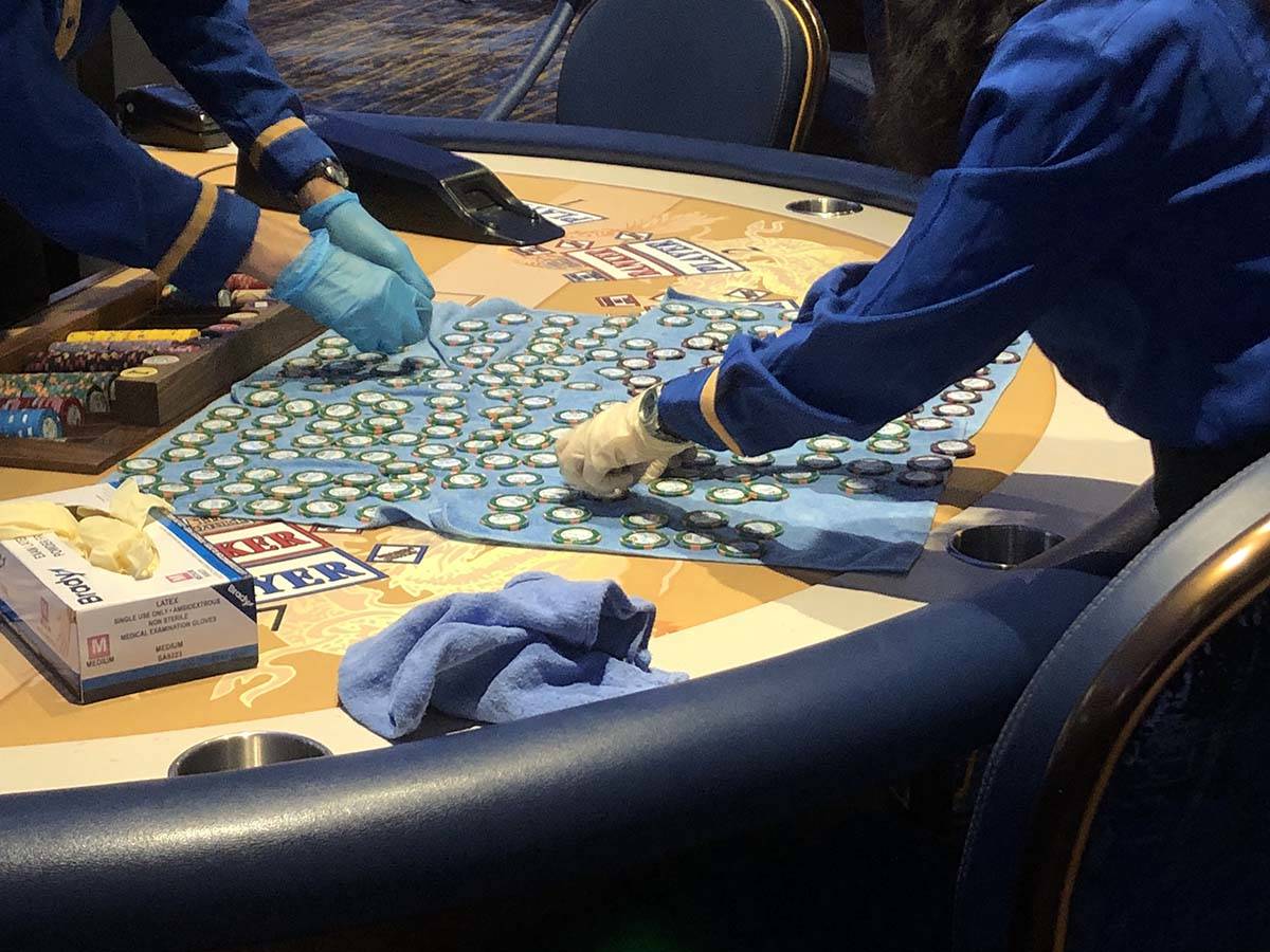 Workers at the Strat clean chips as the casino reopens on Thursday, June 4, 2020. (Katelyn Newb ...