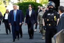 President Donald Trump departs the White House, accompanied by Secretary of Defense Mike Esper, ...