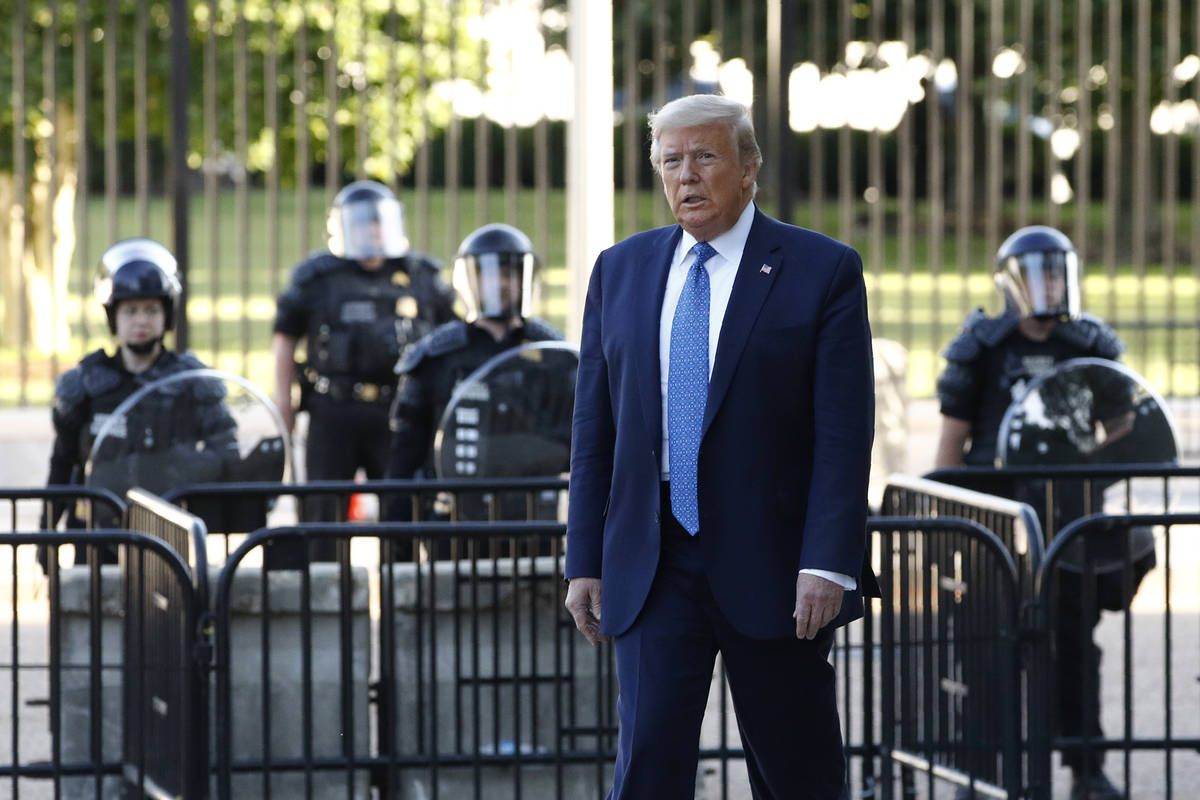 President Donald Trump walks in Lafayette Park to visit outside St. John's Church across from t ...