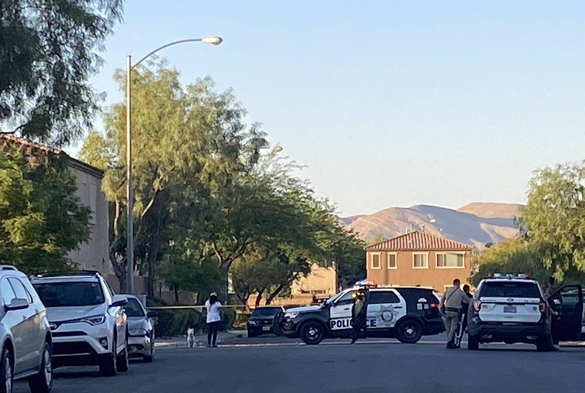 Las Vegas police have a street blocked with tape at the scene of a homicide in the 8800 block o ...