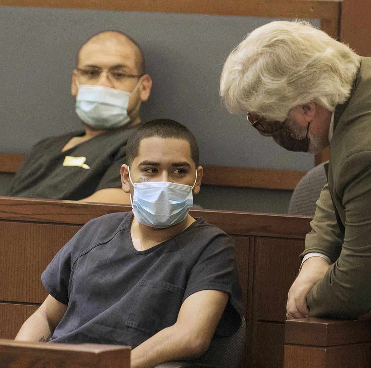 Edgar Samaniego, charged in shooting of Las Vegas police officer, listens to his defense attorn ...