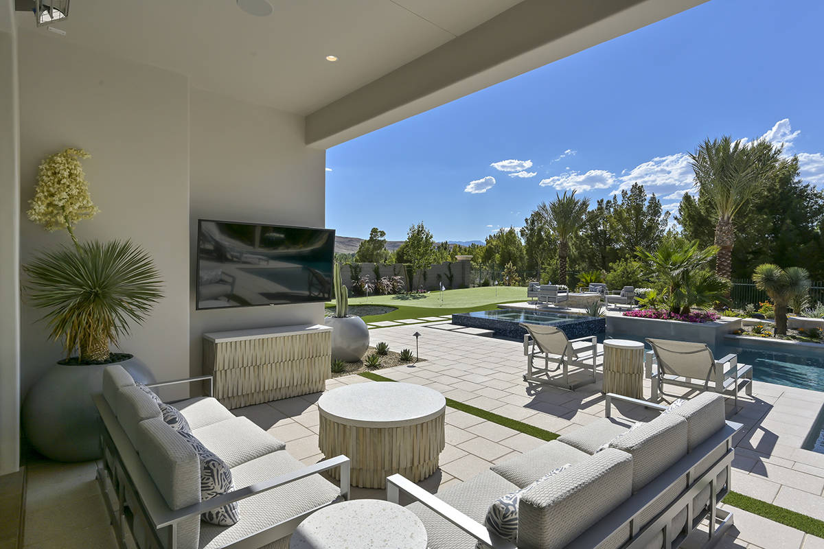 The 5,100-square-foot Southern Highlands home features an outdoor patio by the pool. (Nartey/Wi ...