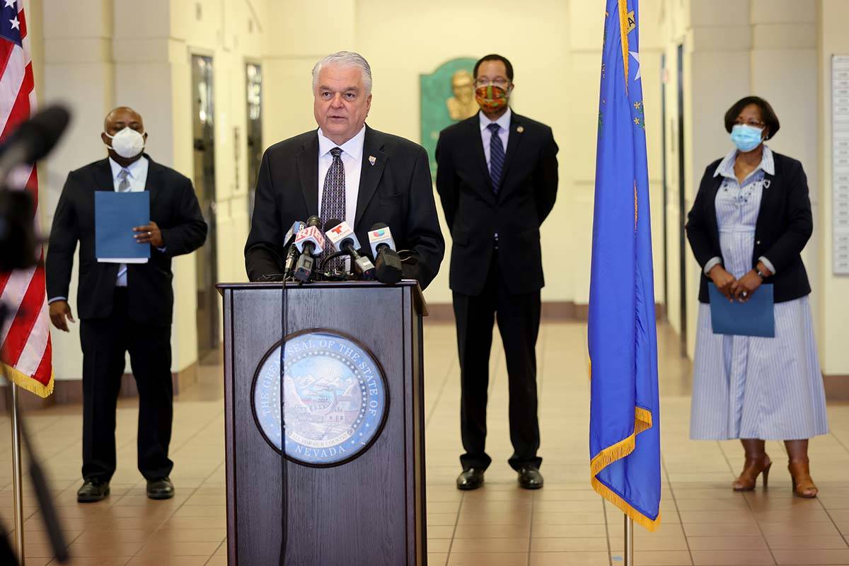 Gov. Steve Sisolak, second from left, speaks during a press conference with, from left, Assembl ...