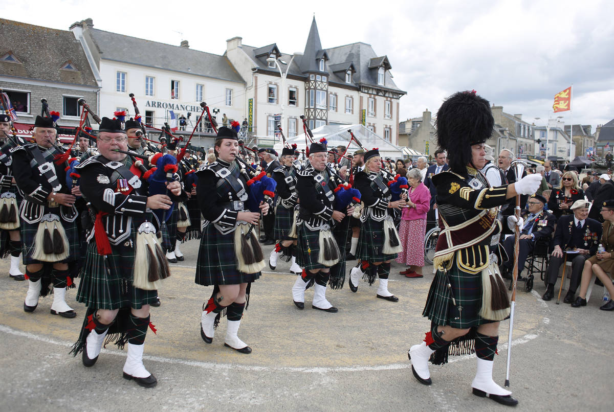 FILE - In this Thursday, June 6, 2019 file photo, bagpipers play during an event to mark the 75 ...