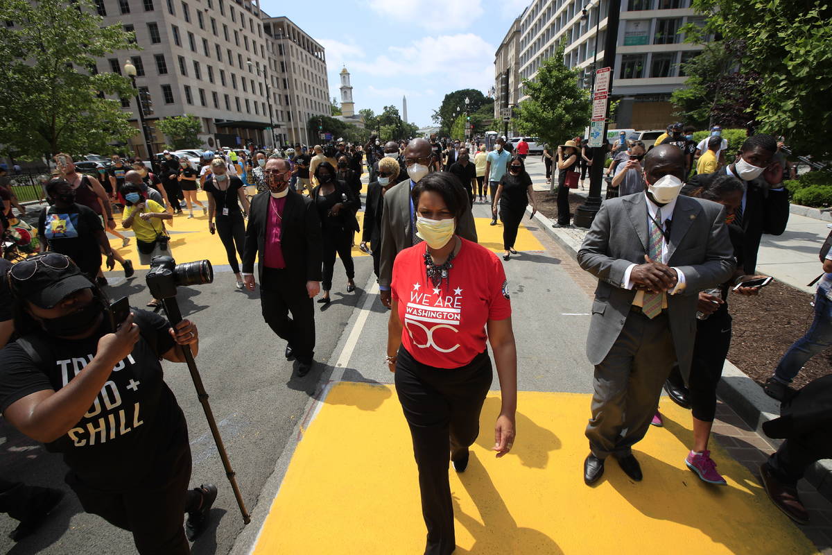 District of Columbia Mayor Muriel Bowser walks on the street leading to the White House after t ...