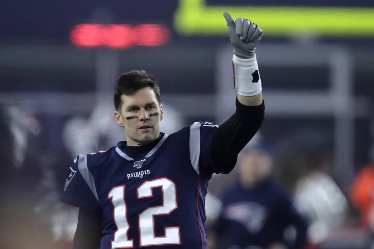 In this Jan. 4, 2020, file photo, New England Patriots quarterback Tom Brady gestures to a team ...