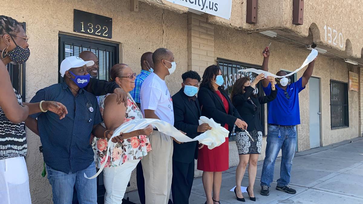 Members of the Soul City WiFi team cutting a ribbon to celebrate the launch of the SoulCity.us ...