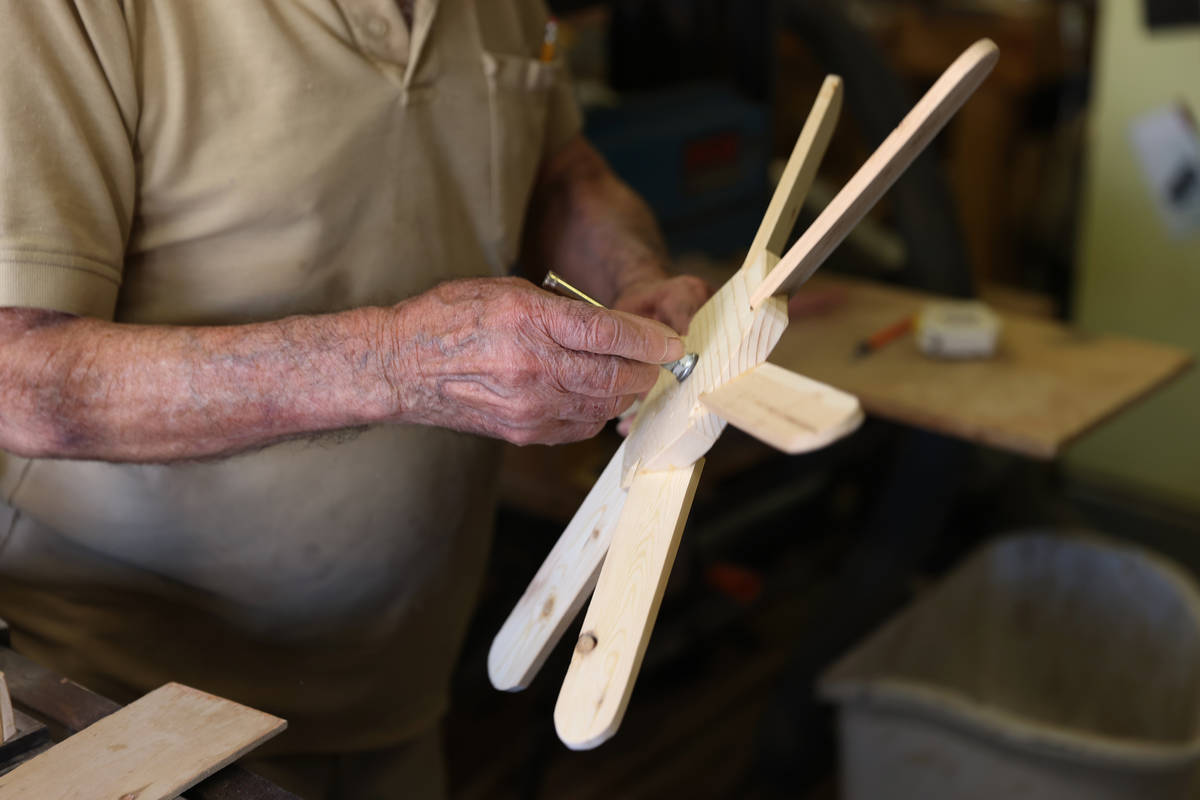 Onofrio "No-No" Zicari, 97, a World War II veteran, works in his wood workshop at his ...