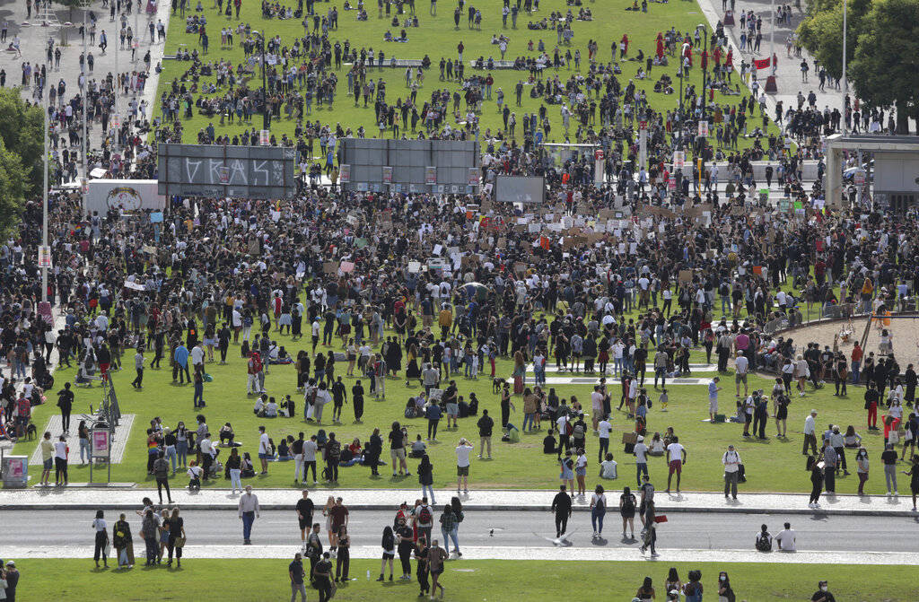 Demonstrators gather for a protest against racism and police violence in Lisbon, Saturday, June ...