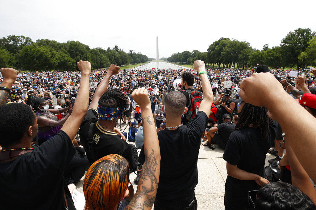Demonstrators protest Saturday, June 6, 2020, at the Lincoln Memorial in Washington, over the d ...