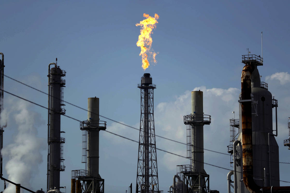 FILE - In this Thursday, Aug. 31, 2017, file photo, a flame burns at the Shell Deer Park oil re ...
