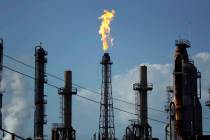 FILE - In this Thursday, Aug. 31, 2017, file photo, a flame burns at the Shell Deer Park oil re ...