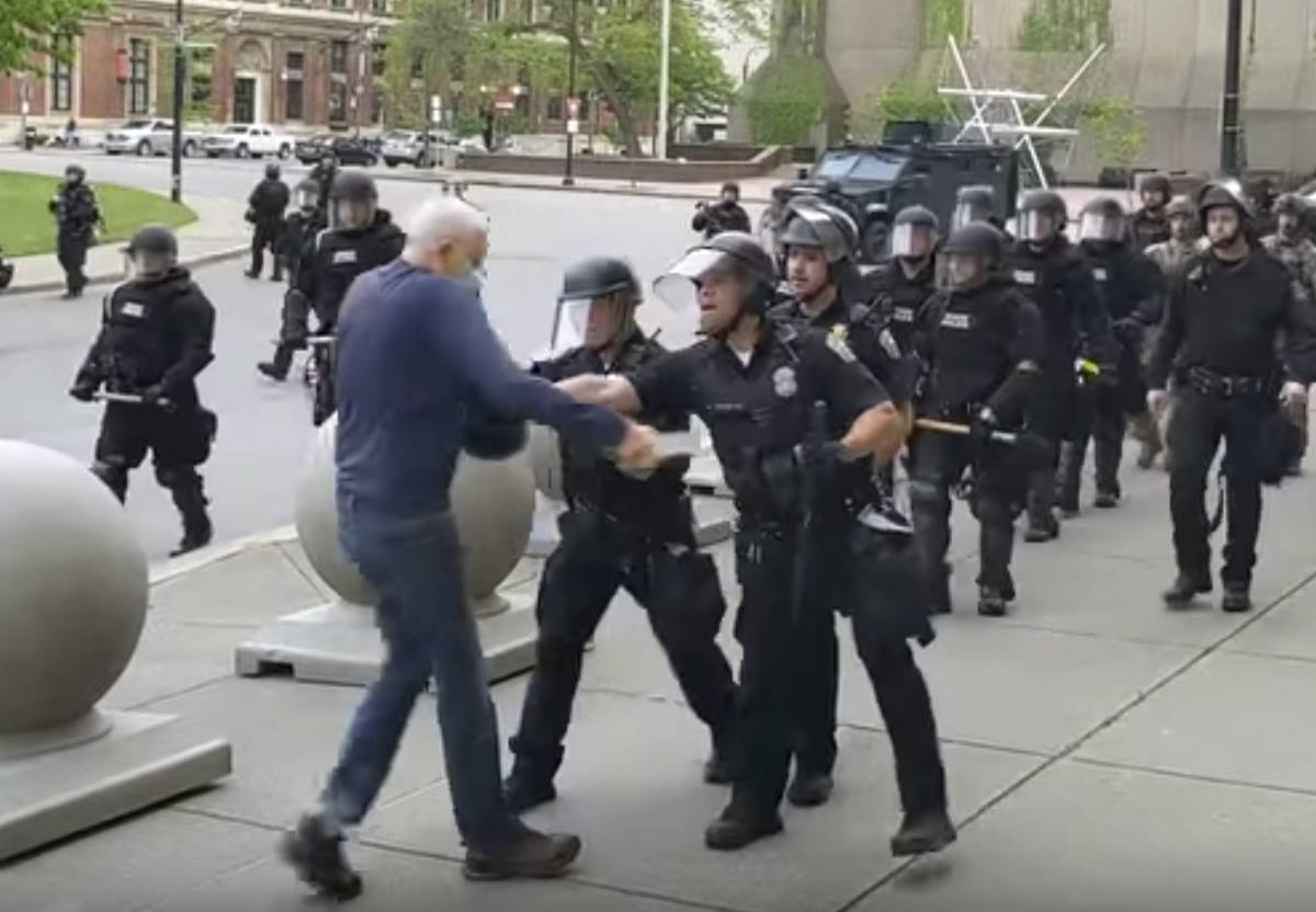 In this image from video provided by WBFO, a Buffalo police officer appears to shove a man who ...