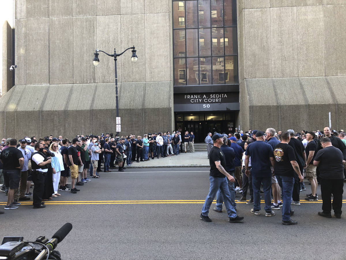 In this photo provided by WKBW, supporters of two suspended Buffalo police officers assemble ou ...