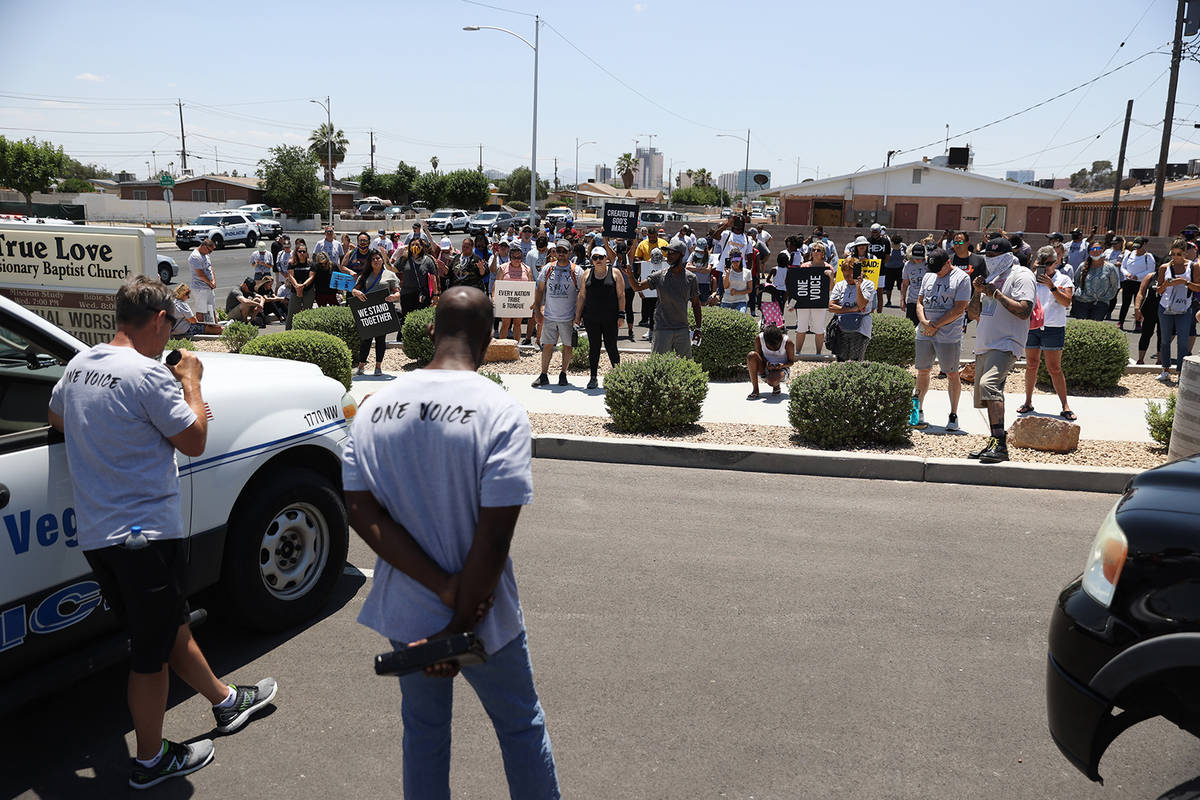 People take a break from a march promoting unity to join in for a prayer outside of the True Lo ...