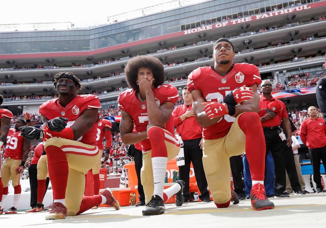 In this Oct. 2, 2016, file photo, from left, San Francisco 49ers outside linebacker Eli Harold, ...