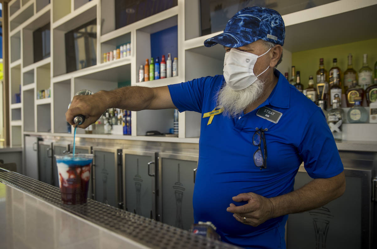 Bartender Rob Lopez makes another drink about the pool at The Strat on Saturday, June 6, 2020 i ...