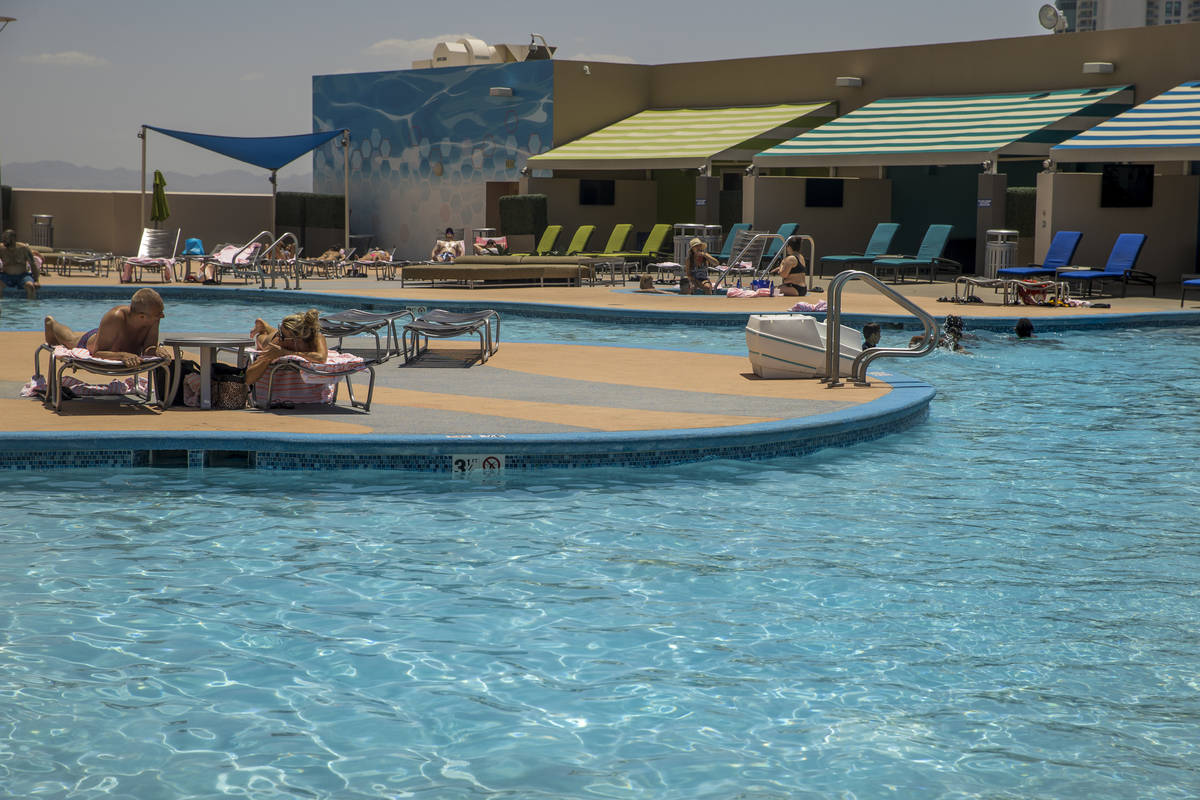 Guests enjoy the nice, cool waters of the pool at The Strat on Saturday, June 6, 2020 in Las Ve ...