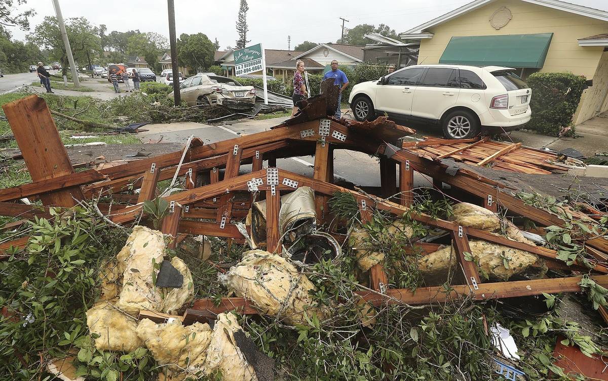 Debris is strewn on the ground Sunday, June 7, 2020, at Lake Margaret Village Apartments follow ...