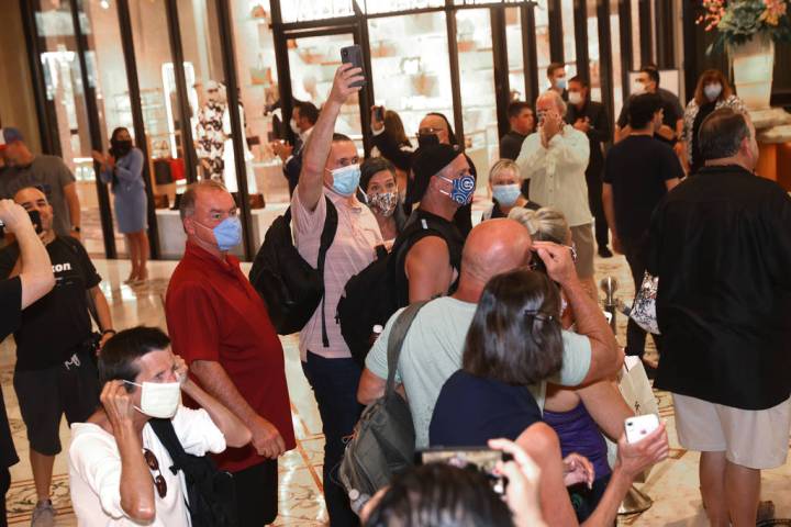 The first guests arrive at the Bellagio on the Strip in Las Vegas as the resort reopens after 7 ...