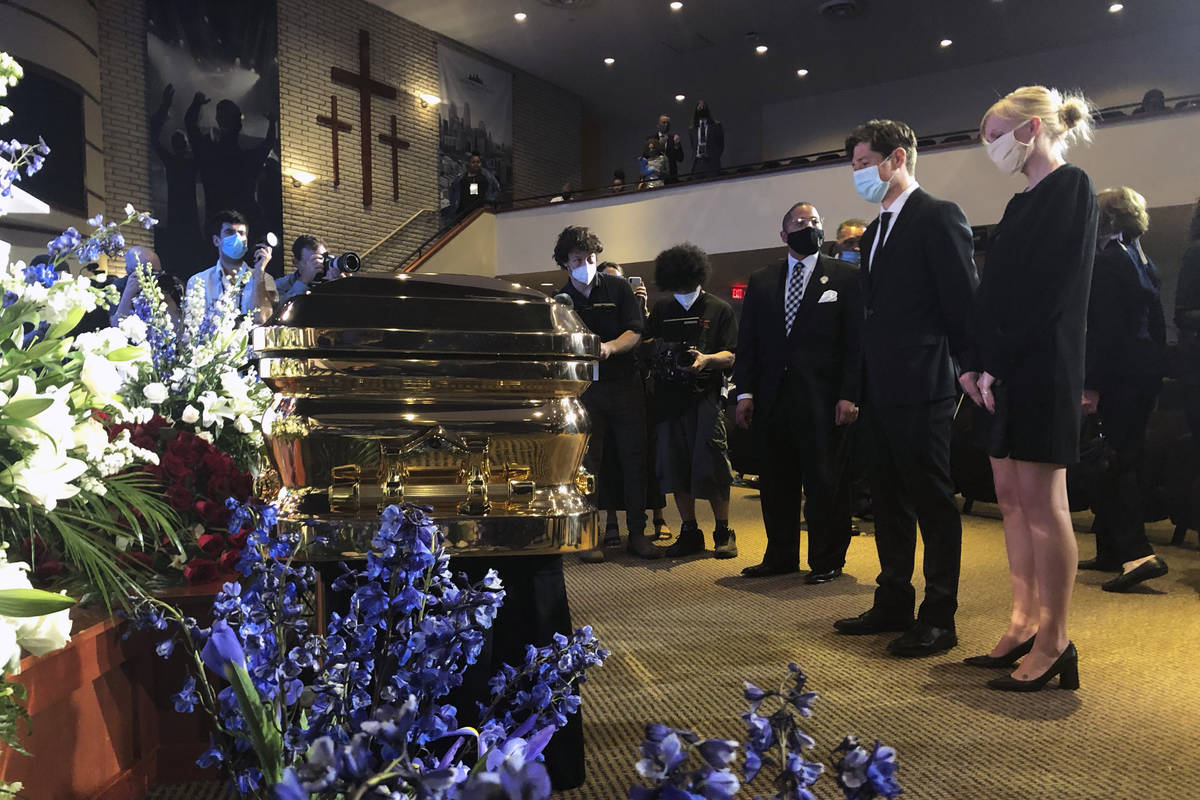 Minneapolis Mayor Jacob Frey, second from right, and First Lady Sarah Clarke, right pause befor ...