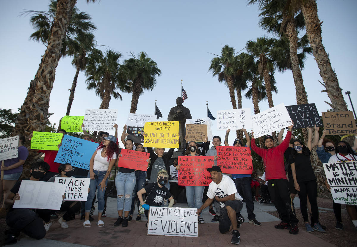 A small group of people came together for a prayer night outside the Martin Luther King Jr. Sen ...