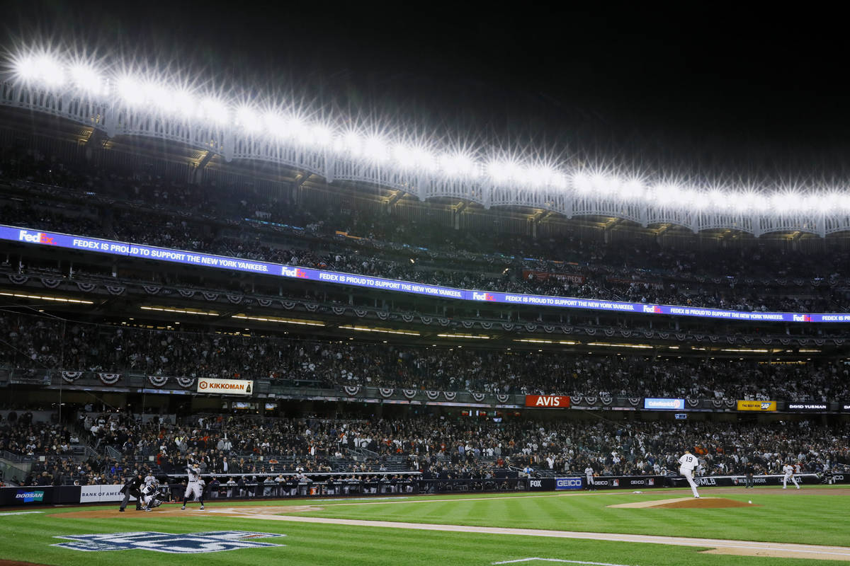 In an Oct. 17, 2019, file photo, New York Yankees starting pitcher Masahiro Tanaka throws again ...