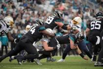 Los Angeles Chargers defensive end Joey Bosa (97) sacks Jacksonville Jaguars quarterback Gardne ...