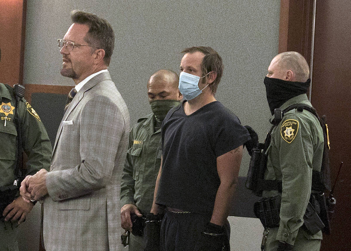 Stephen Parshall, center, one of three alleged Boogaloo Boys extremists charged with planning v ...
